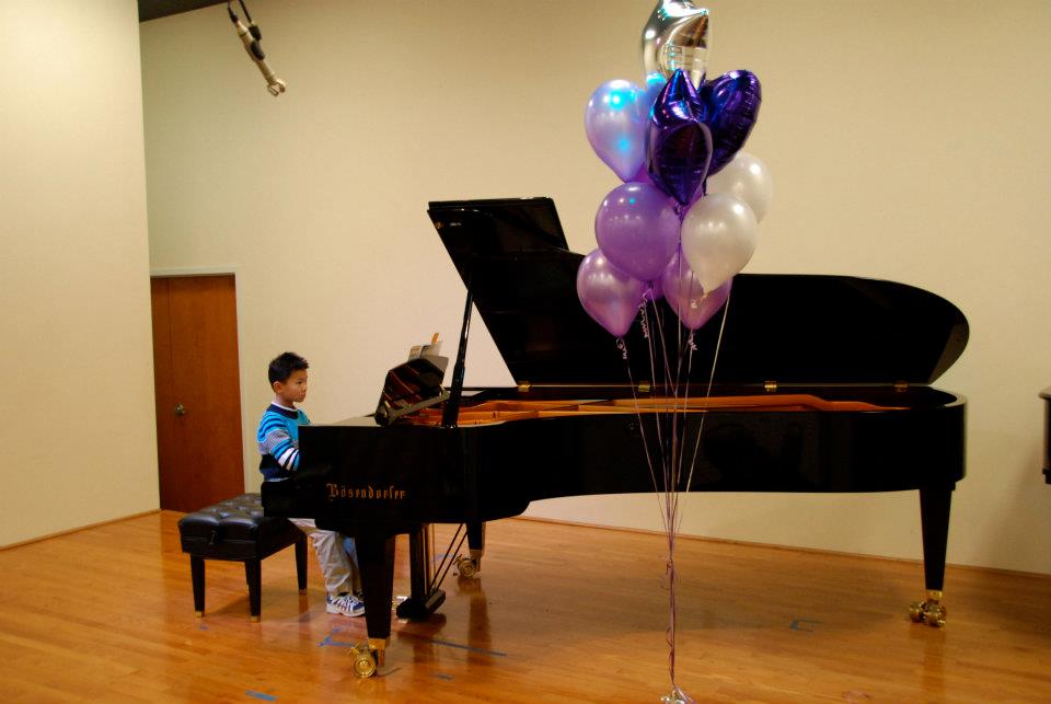 boy playing piano